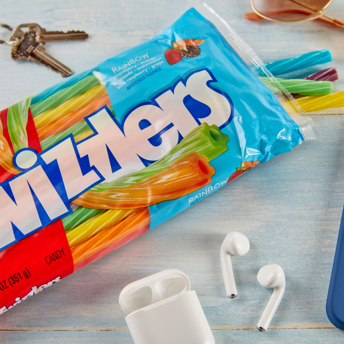 Twizzlers Twists rainbow flavors close-up, vibrant visuals boost party displays.