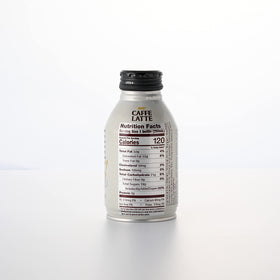 Close-up of UCC Caffe Latte label, emphasizing Japanese origin and quality.