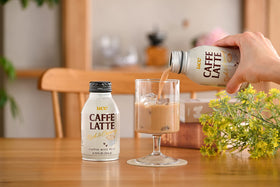 Boxed 24-bottle pack of UCC Caffe Latte highlighting value and convenience.