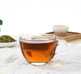 ULTHMOK brewed cup of guava leaf tea highlighting caffeine-free relaxation