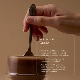 Ultra Life Sport ceremonial cacao powder poured into a mug for a gentle energy boost.