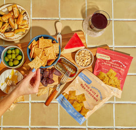 Snack scene with Unbothered Foods crackers showing nut-free and no added sugar