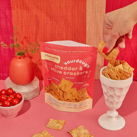 Pair Unbothered crackers with goat cheese for a snack board idea.