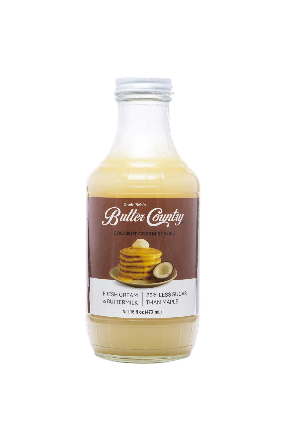 Uncle Bob's Butter Country coconut syrup being poured over pancakes for tropical flavor