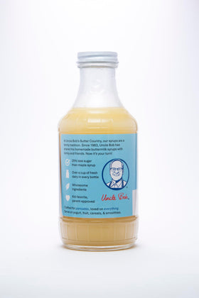 Refrigerated glass bottle of Uncle Bob's Butter Country syrup