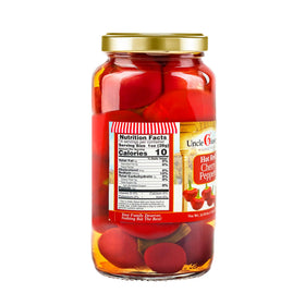 Sliced Uncle Giuseppe’s cherry peppers on a board for antipasto or snacks