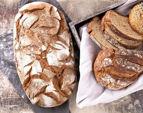Loaf in the oven using Unpretentious Baker White Rye Flour, showcasing bake-ready versatility.