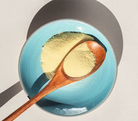 Unpretentious Banana Powder scoop demonstrates portion control for recipes.