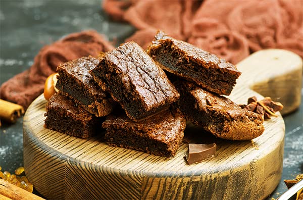 Unpretentious Cocoa Powder being used to prepare hot cocoa or beverages.