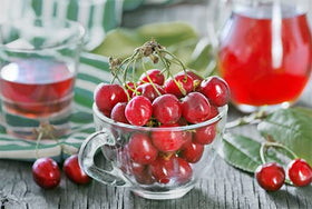 Unpretentious Tart Cherry Powder added to smoothie bowl shows vibrant color.
