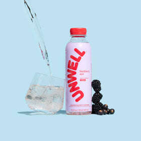 Unwell Hydration glass pour shows easy on-the-go hydration with flavor.