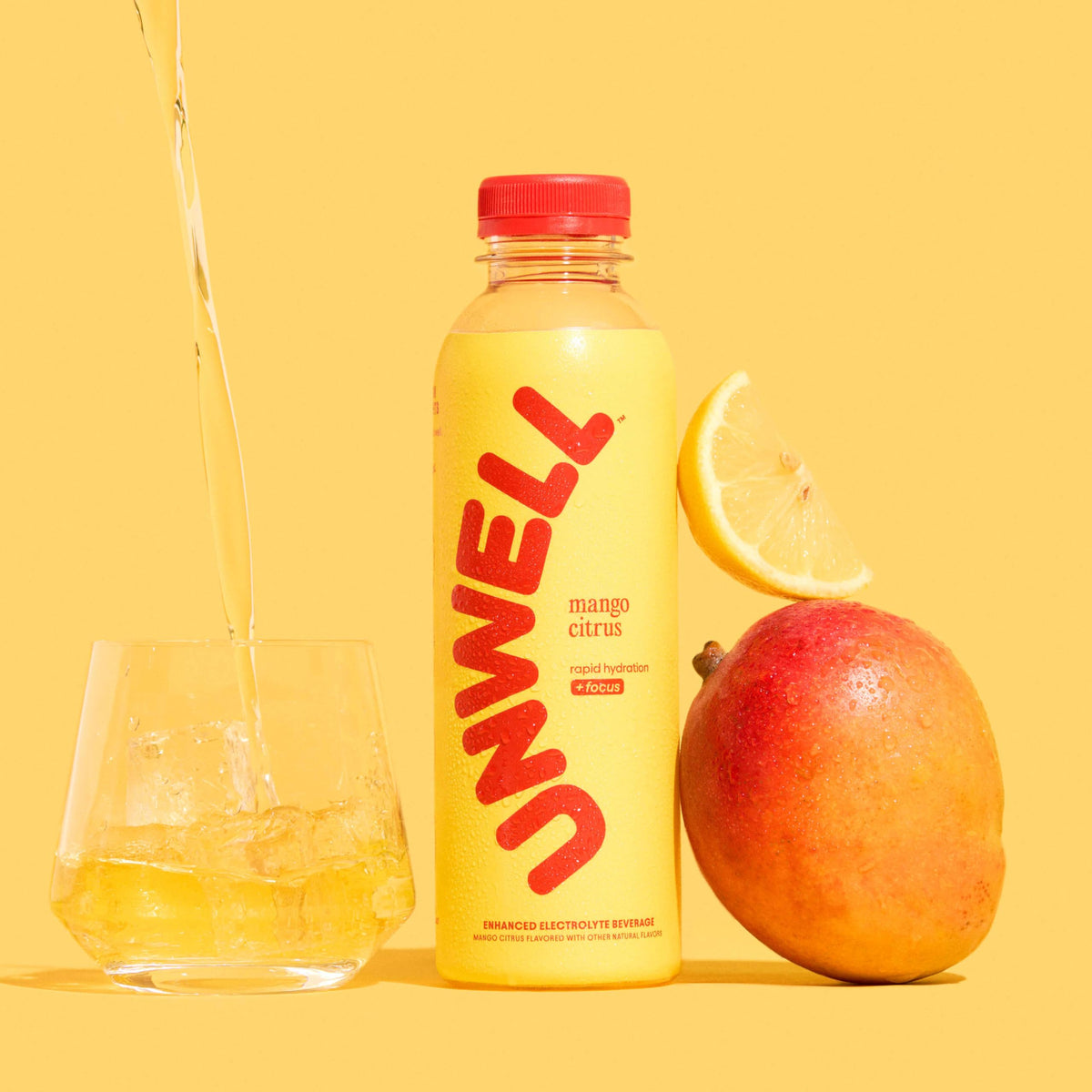Unwell Hydration mango citrus glass ready to sip during a busy day.