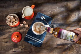 Upouria French Vanilla syrup over desserts or coffee for flavor enhancement.