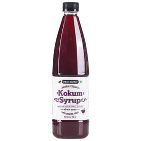 Urban Platter Kokum Syrup being poured into a glass for a tangy drink