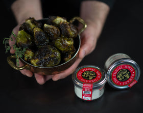 Urbani Truffles salt shaker on kitchen counter for quick finishing.