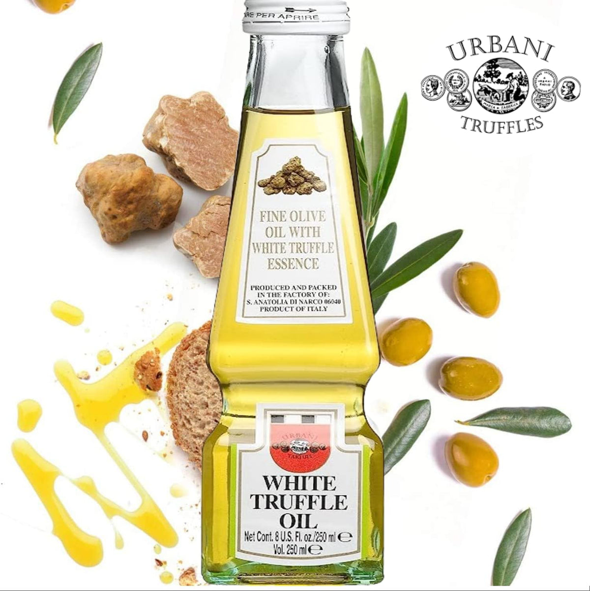 Pouring Urbani White Truffle Oil over a risotto for aroma.