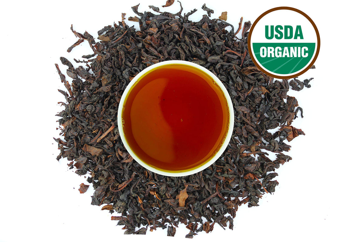 US Wellness Naturals Earl Grey tea in a ceramic cup; bright bergamot aroma for a refreshing morning.
