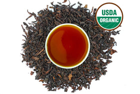 US Wellness Naturals Earl Grey tea in a ceramic cup; bright bergamot aroma for a refreshing morning.