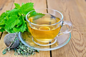 U.S. Wellness Naturals lemon balm tea steeping in a cup with a gentle aroma