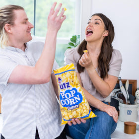 Utz Butter Popcorn in a lunchbox, convenient snack for school or work.