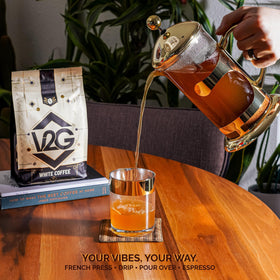 Aromas of V2G White Coffee rise as steam escapes.