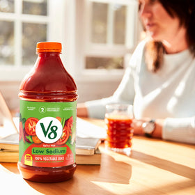 Close-up of V8 label showing 100% vegetable juice and vitamins.