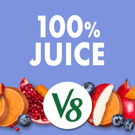 Close-up of ingredients featuring apples, carrots, pomegranates, and blueberries