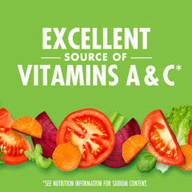 Close-up of tomato and greens ingredients in the juice blend.