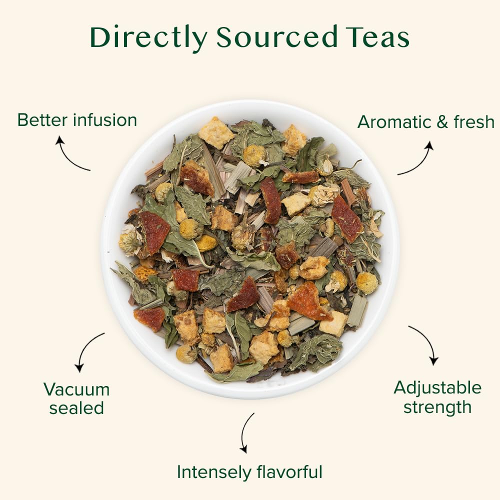 VAHDAM Chamomile Mint Citrus Green Tea leaves steeping in a cup releasing garden-fresh aroma.