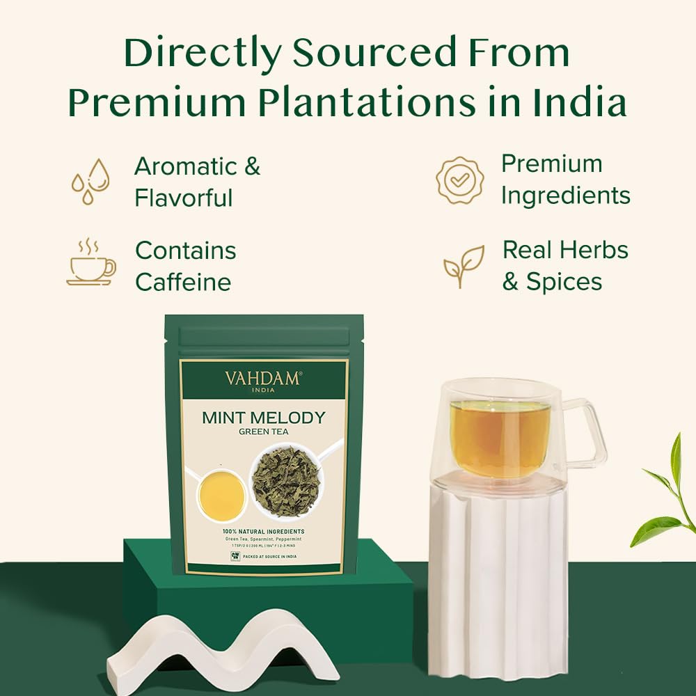VAHDAM steaming cup with mint leaves evoking a lively, aromatic breeze