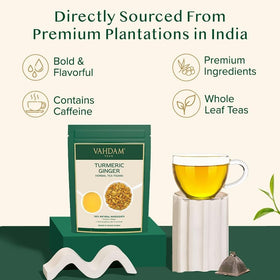 VAHDAM turmeric ginger herbal tea brew infusing with vibrant color and aroma