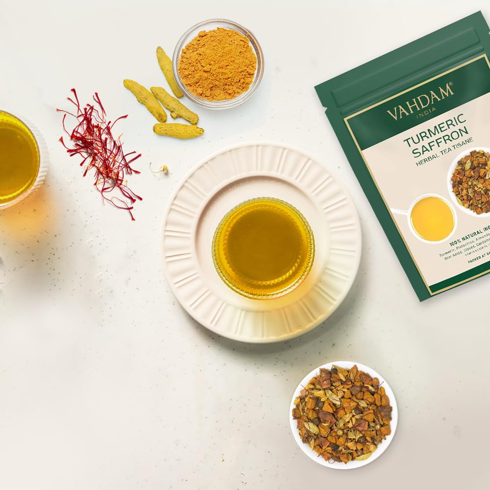 VAHDAM Herbal Tea ingredients featuring cardamom, almonds, pistachios, and ginger