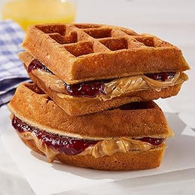 Vallary grape jelly cup close-up, crisp flavor for sandwiches.
