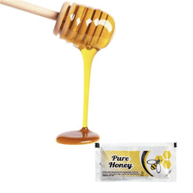 Close-up of Vallary honey packet showing amber-gold color and pure sweetness.