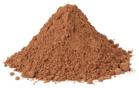 Valrhona 159 cocoa powder in a scoop shows a rich red mahogany color for baking and beverages.