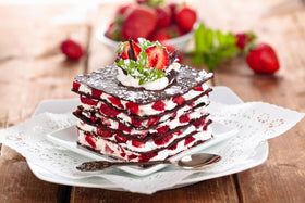 Vanilla Bean Kings Strawberry Extract baking-pan scene suggests versatile use in desserts.