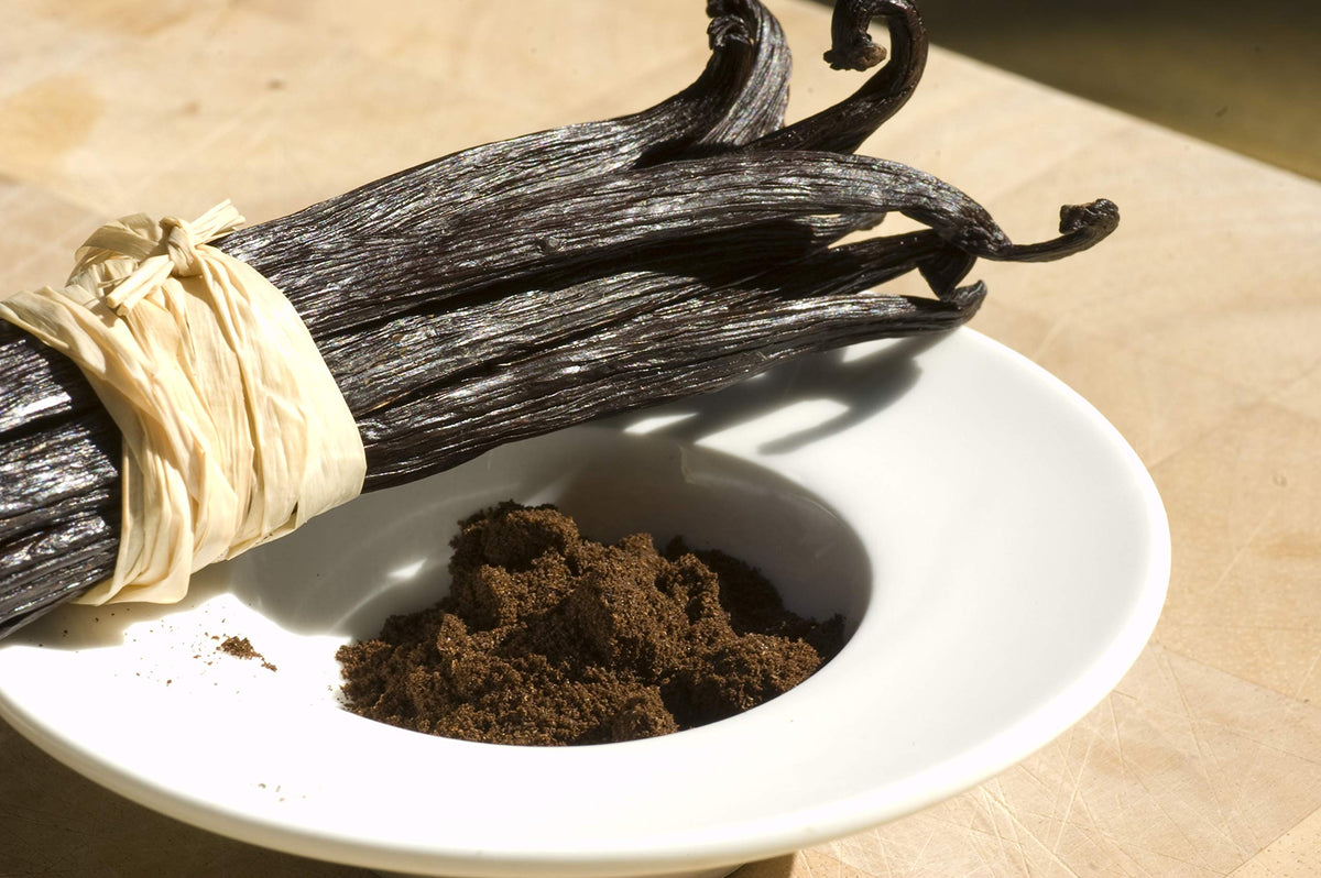 Vanilla Bean Kings vanilla powder poured into coffee for enhanced aroma.