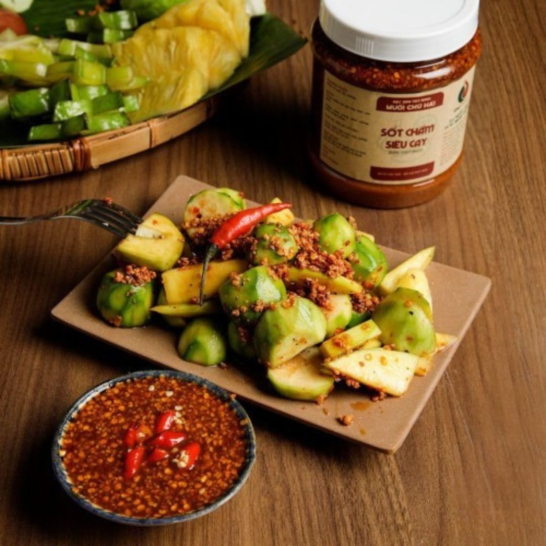 Mango slices dipped in Veefood Uncle Hai’s sauce for a bright, zesty snack