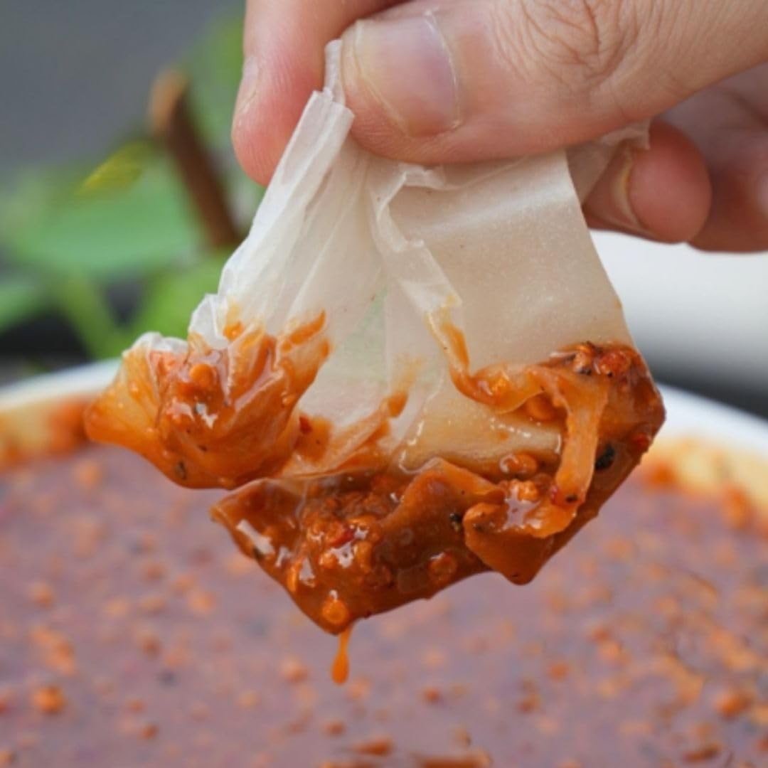 Sauce glaze on seafood with Uncle Hai’s chili salt for savory gloss