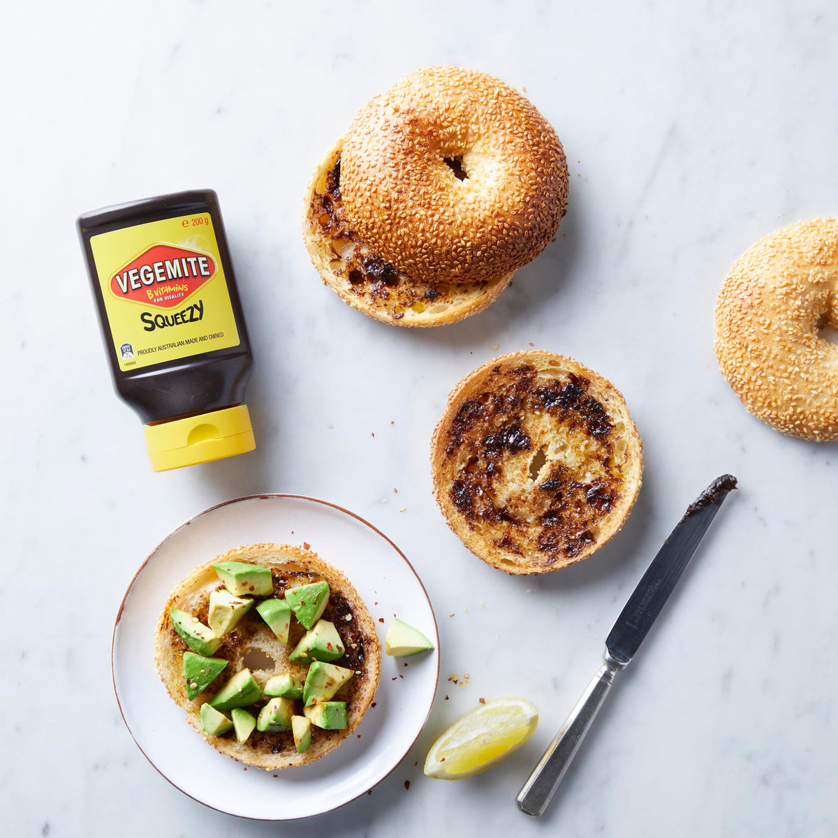 Vegemite Squeezy bottle closeup shows rich umami color and texture.