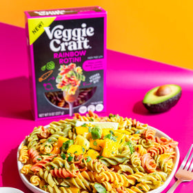 Vibrant rainbow rotini served at a family dinner, Veggiecraft Farms