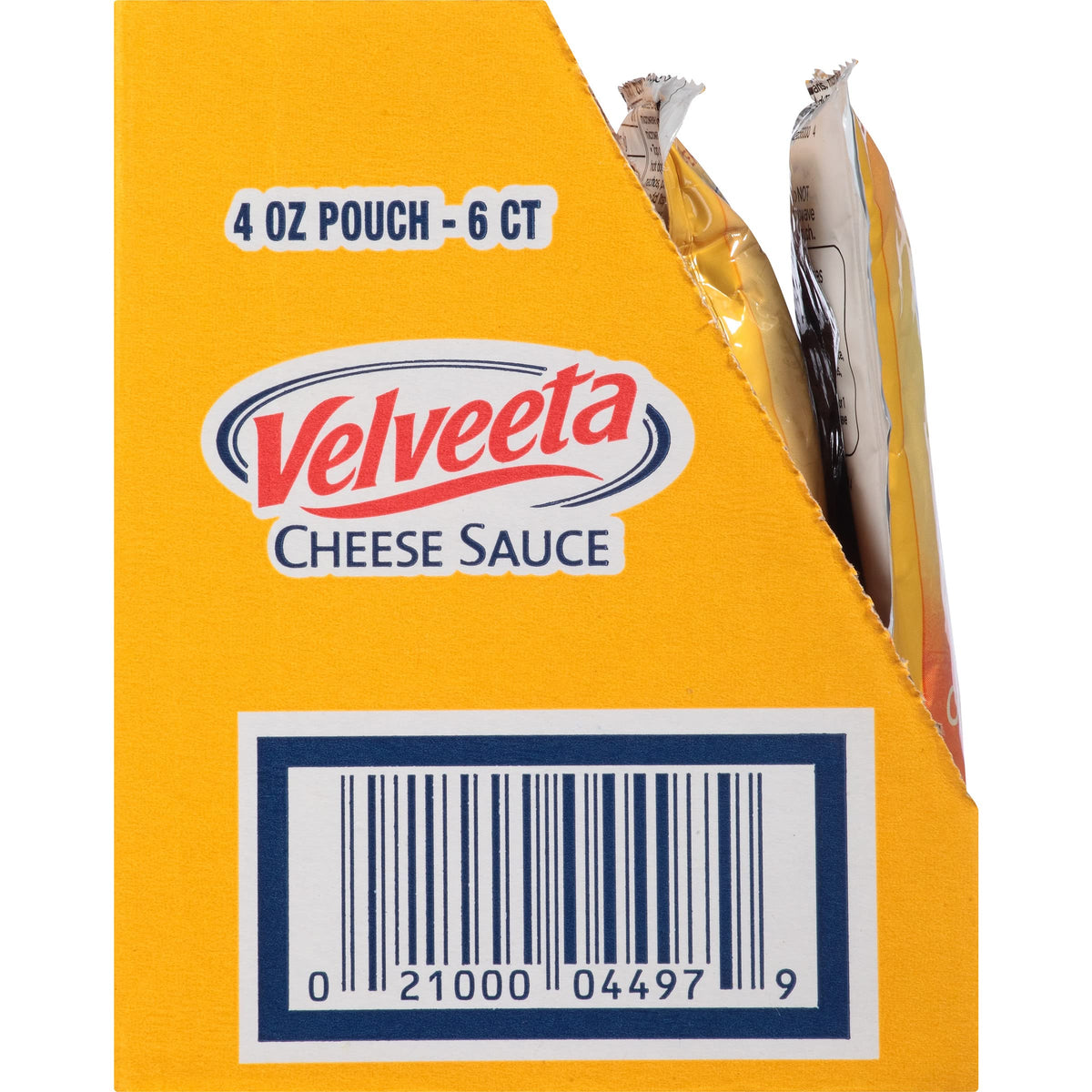 Velveeta cheese sauce poured over a baked potato.