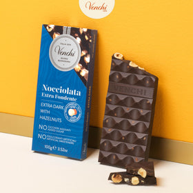 Venchi NO Added Sugar Dark Hazelnut Bar cross-section reveals whole Piedmont hazelnuts