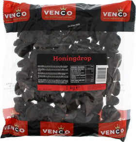 Venco Honey Honingdrop licorice slices closeup, glossy texture invites tasting.