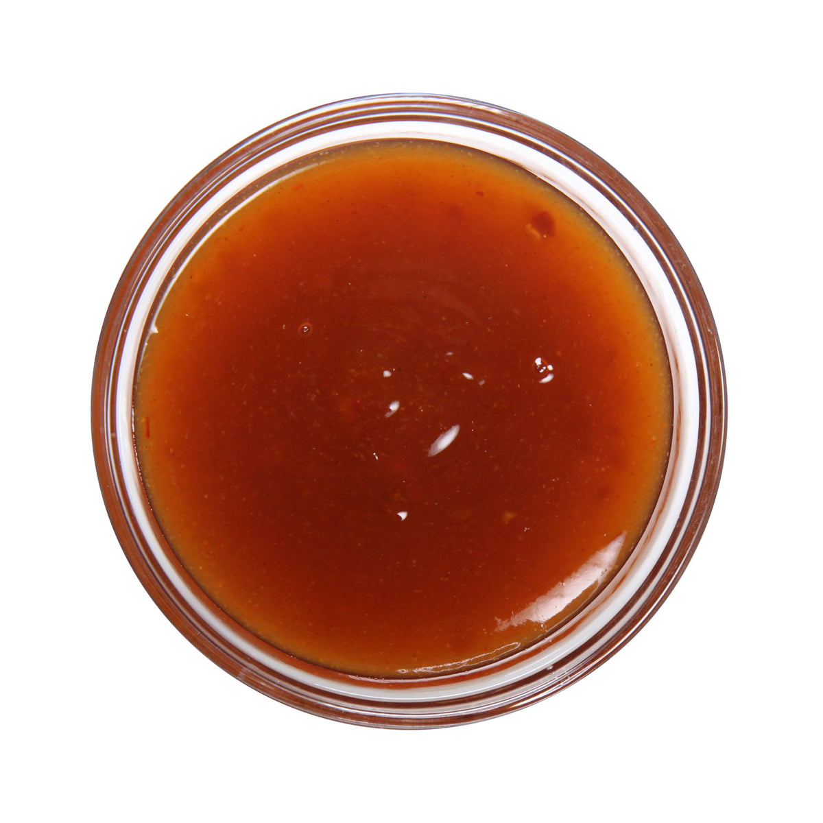 Ventura Foods Mango Habanero bottle ready to glaze chicken wings with tropical heat.