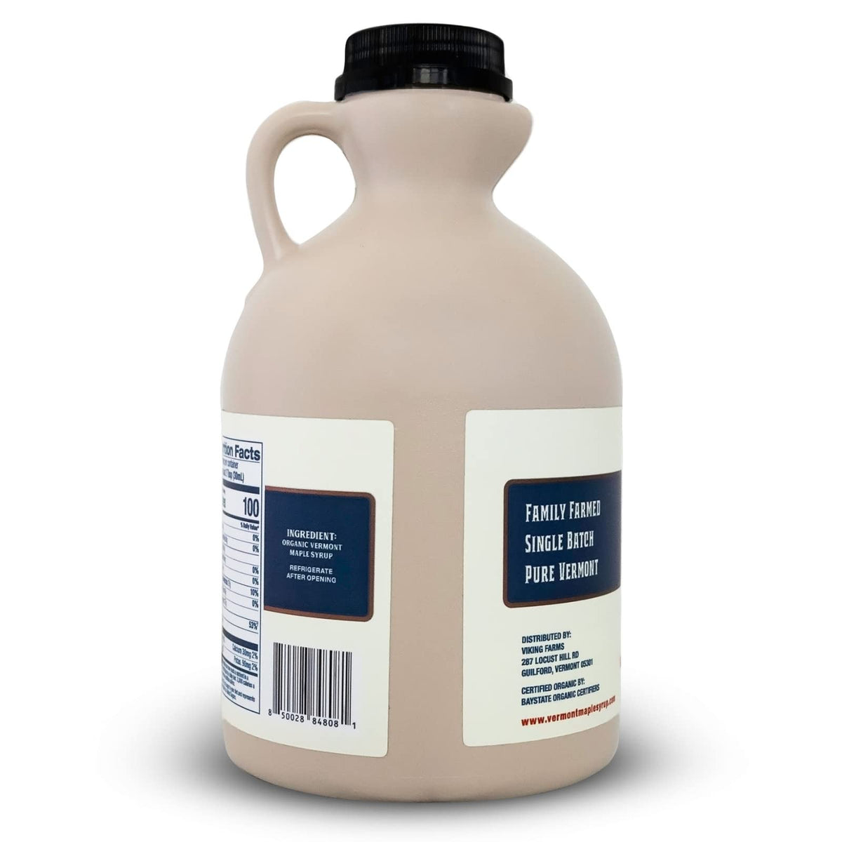 Dark amber Vermont Maple Syrup in a glass jar, ideal for waffles.