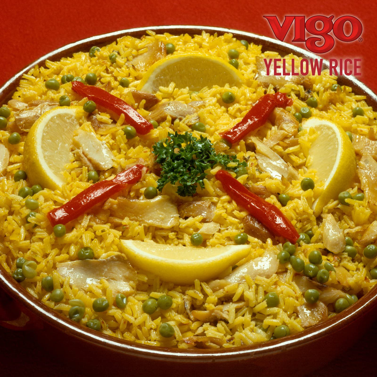 Vigo saffron yellow rice paired with grilled meat creates a hearty meal.