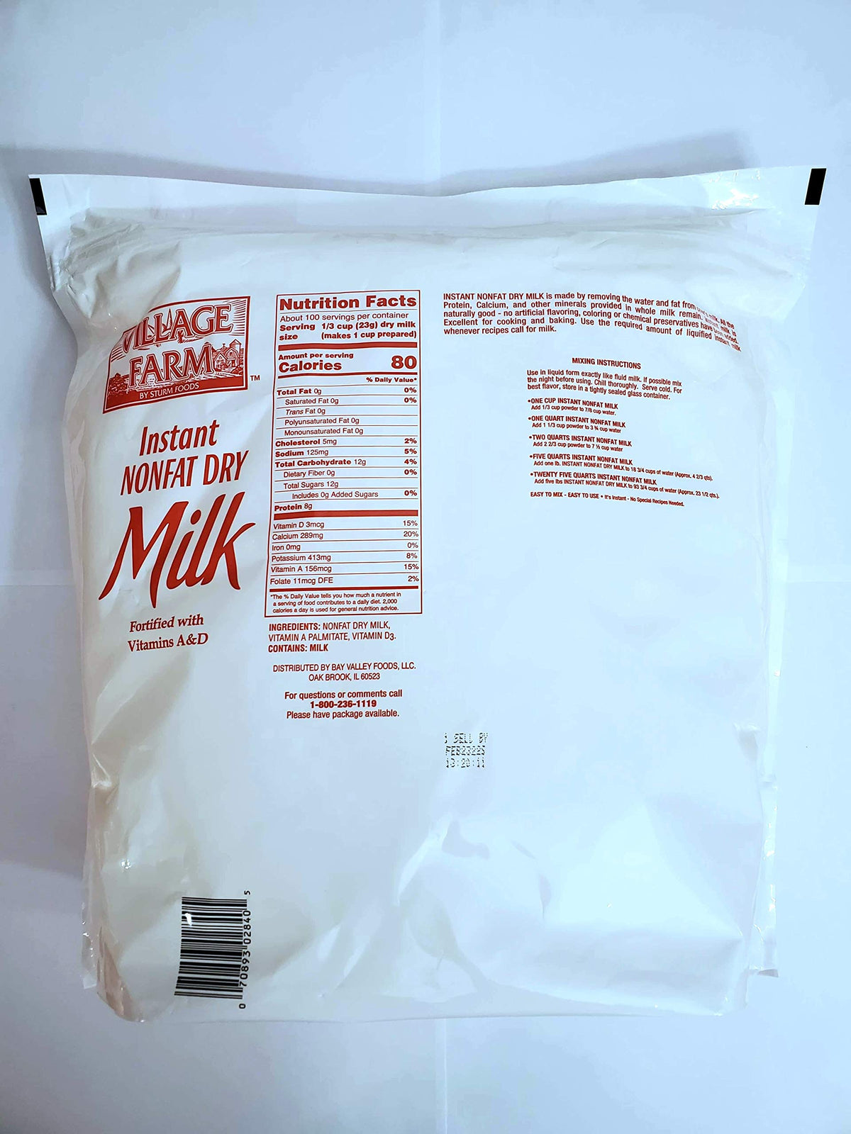 Village Farm instant nonfat dry milk powder, ideal for quick beverage and baking prep.