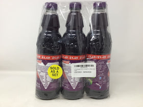 Glass with Vimto Squash, colorful splash, ideal for kids' parties.