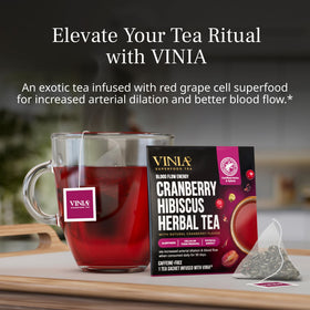 VINIA Cranberry Hibiscus brew in cup with vibrant ruby color.